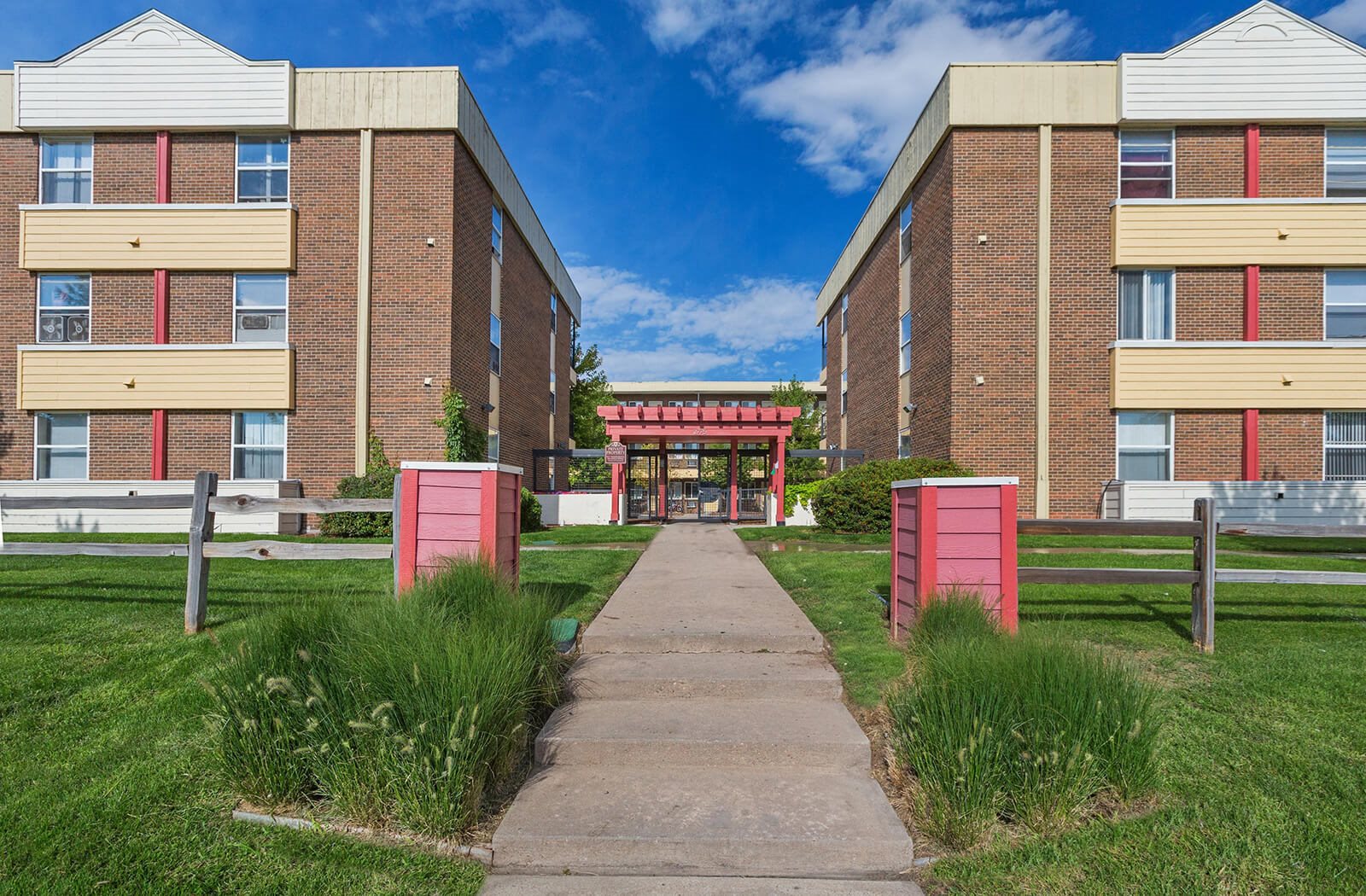 Exterior of Denver apartment building with grassy lawn